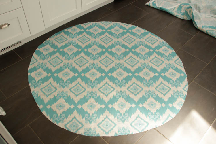 The new blue and white fabric cut out on the floor in a circle.
