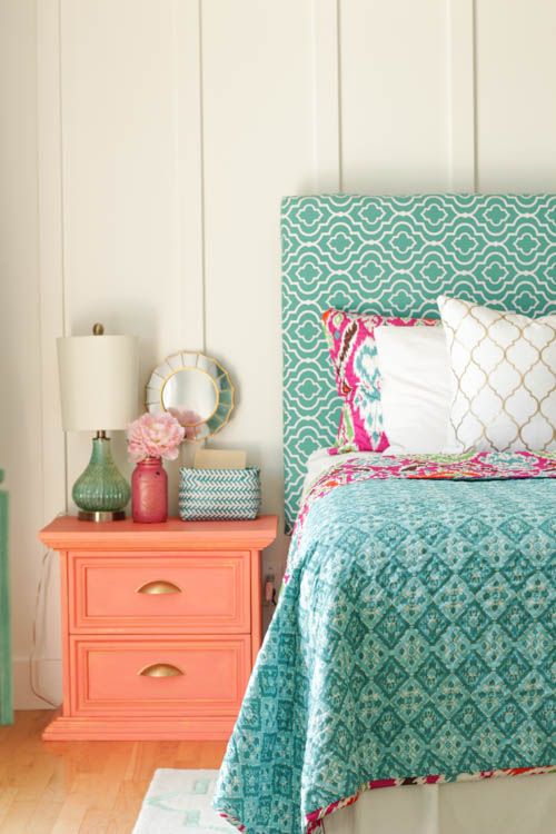 A light peach side table beside the bed.