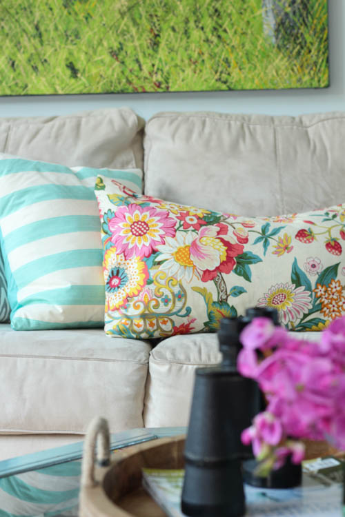 Floral pillow on the couch.