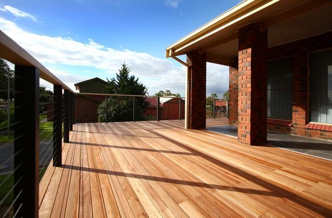 A large wrap around wooden deck.