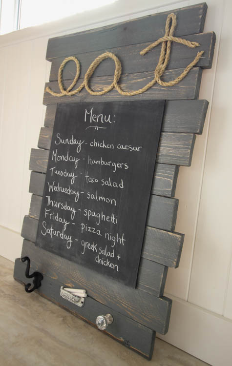 DIY Pallet Sign Menu Board on its side leaning on the wall.