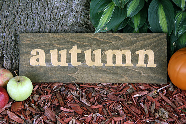 A wooden autumn sign.