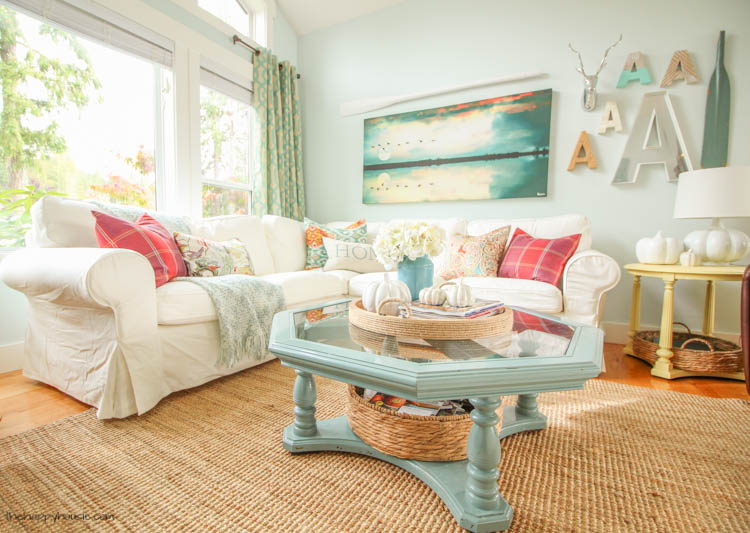 The white couch, turquoise coffee table and basket underneath the coffee table.