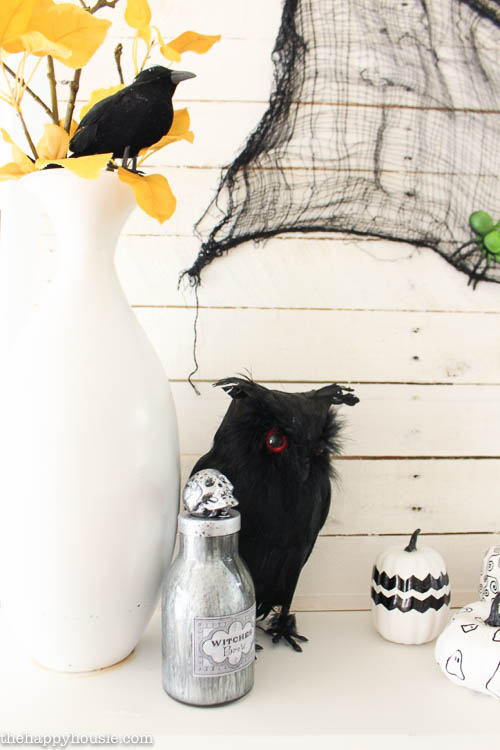 I love this fun black white and yellow Halloween Mantel with all kinds of DIY Halloween Decor projects at thehappyhousie.com-2