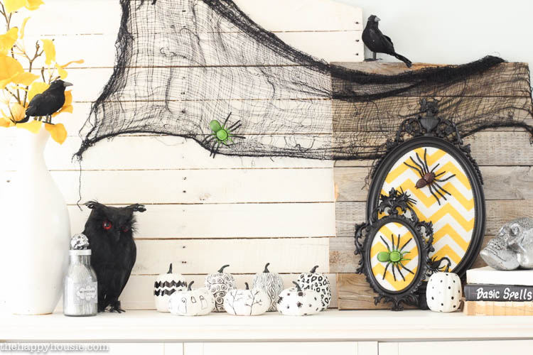 A Halloween vignette with black, white and yellow.