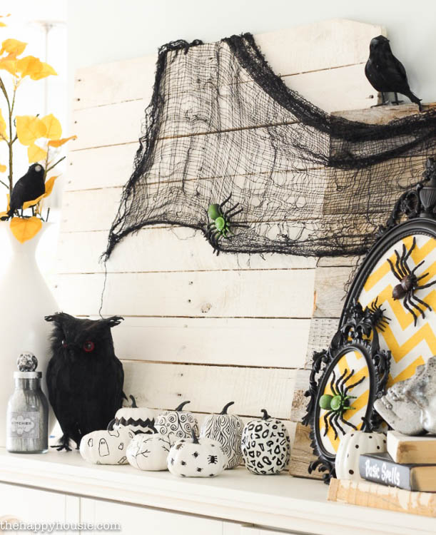 I love this fun black white and yellow Halloween Mantel with all kinds of DIY Halloween Decor projects at thehappyhousie.com-9