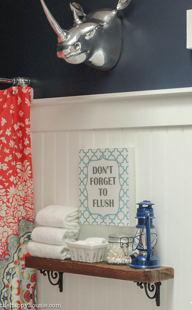 Boho Chic Bathroom Makeover with Hale Navy, Coral and Turquoise with a sign that says Don't Forget to Flush above the toilet.