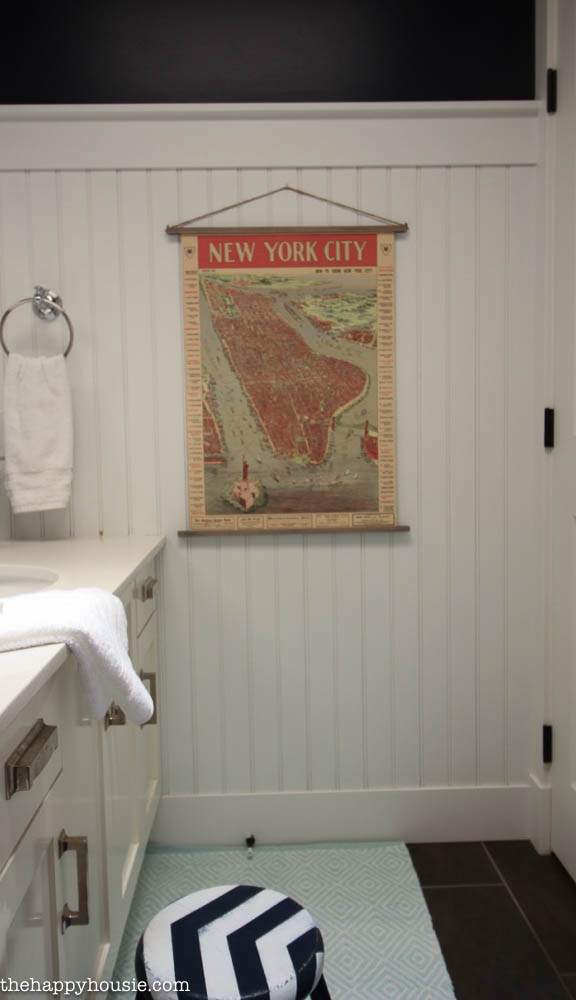 There is a small map of New York City on the wall in the bathroom.