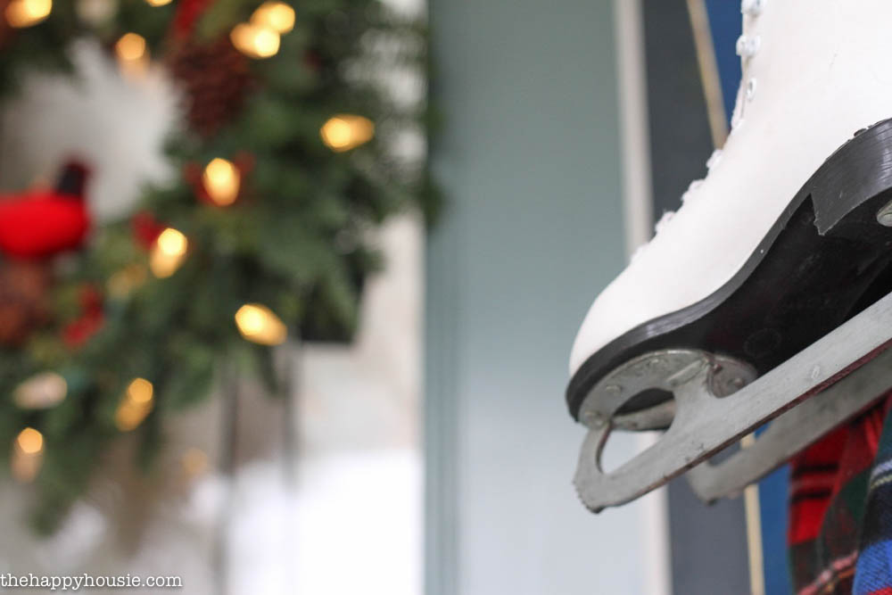 White skates hang by the door.