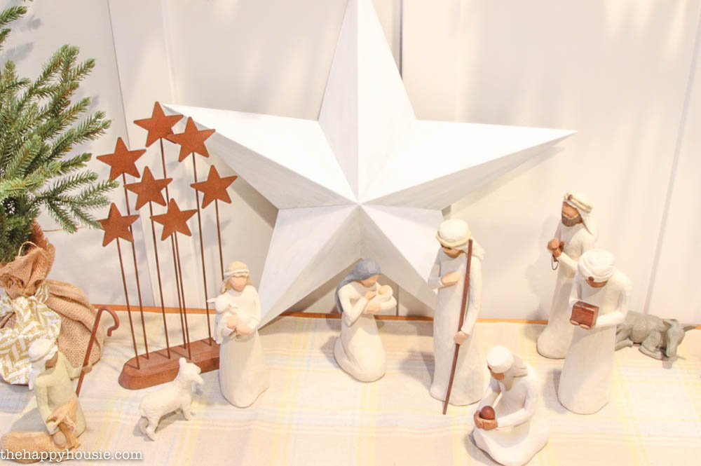 A nativity scene and a star decorate the table.