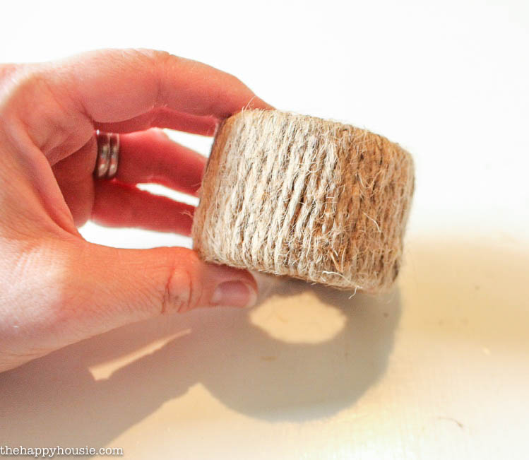 The twine wound around the holder, holding it to show the tightness.