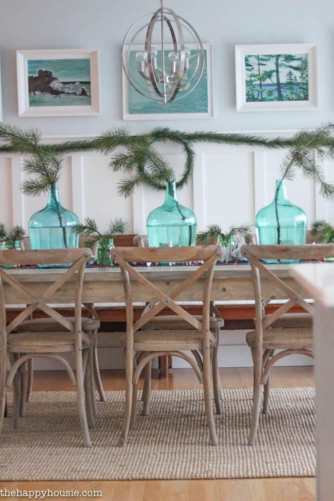Come tour this Christmas dining with lots of natural and rustic touches and watery green and blues - coastal lake cottage Christmas at thehappyhousie.com-18