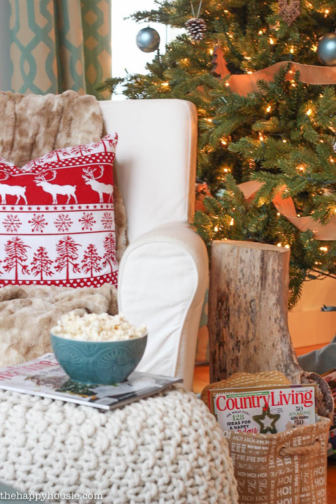 Come tour this Christmas living room with lots of natural and rustic vintage touches as well as hits of red - coastal lake cottage Christmas at thehappyhousie.com-23