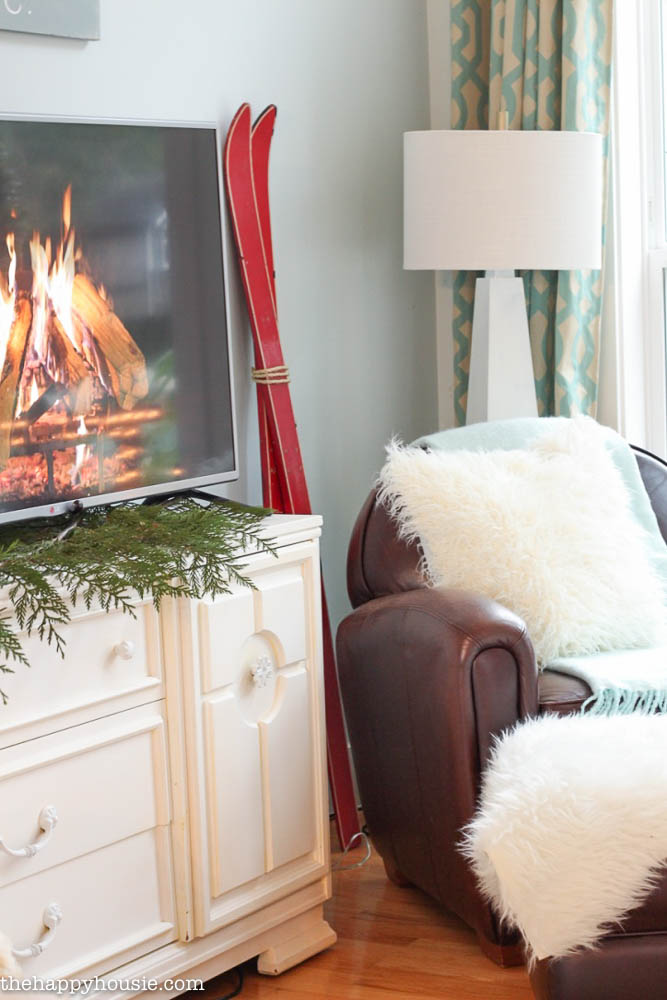 Come tour this Christmas living room with lots of natural and rustic vintage touches as well as hits of red - coastal lake cottage Christmas at thehappyhousie.com-24