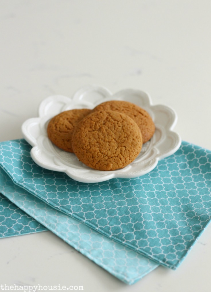 Ginger cookies on a white plate with the napkins.