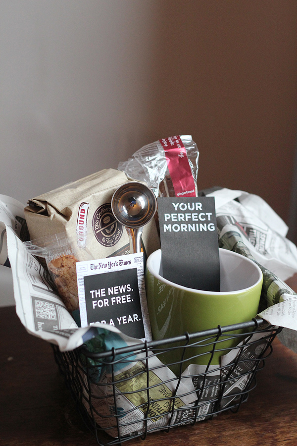 A morning box with a mug, coffee and treats.