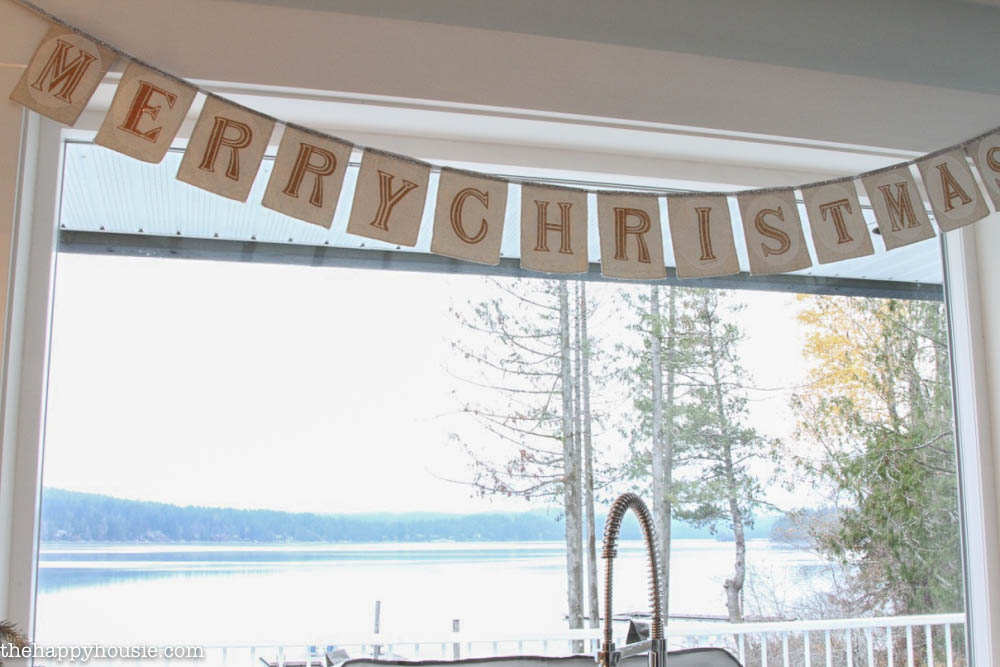 A Merry Christmas banner above the sink in the kitchen.
