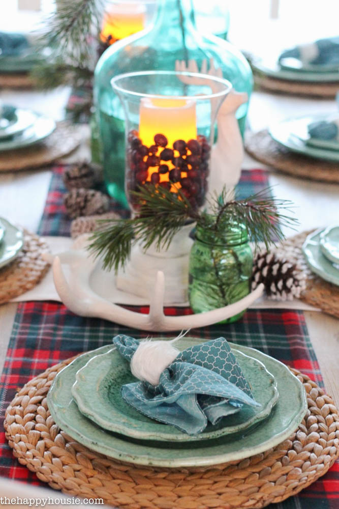 The light blue/green plates and sisal rope chargers on the table.