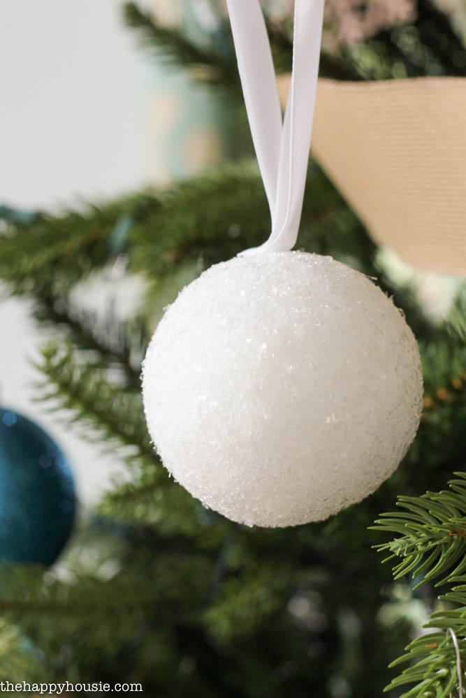 Up close picture of the glittery snowball ornament.