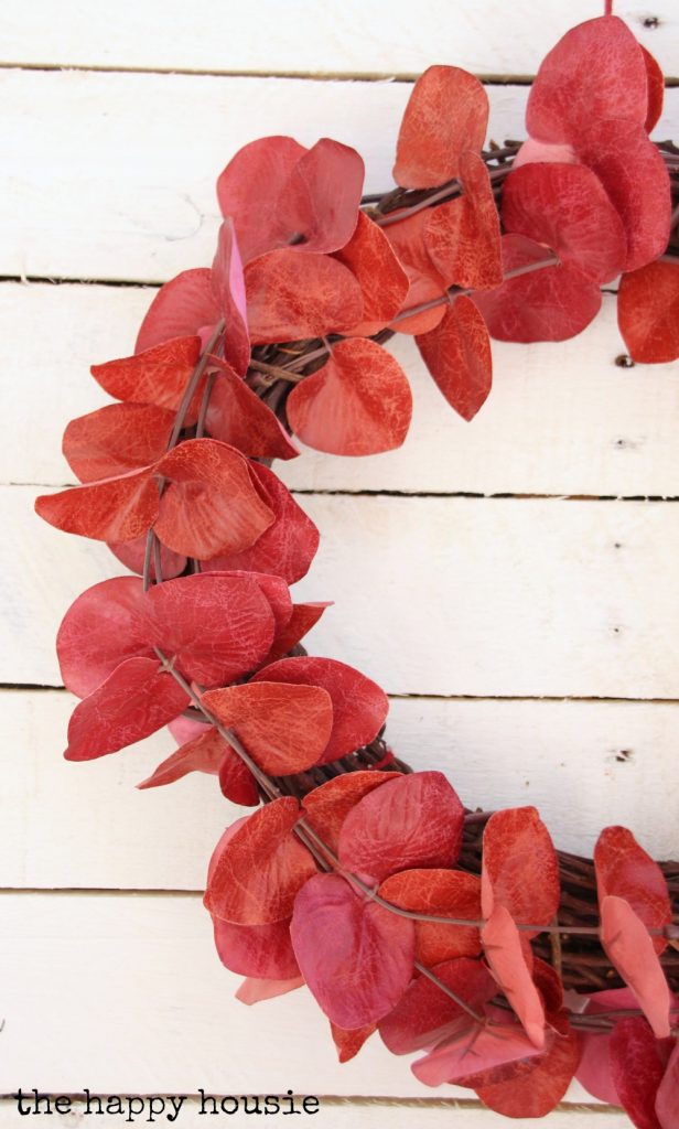 Red leaves on a wreath.