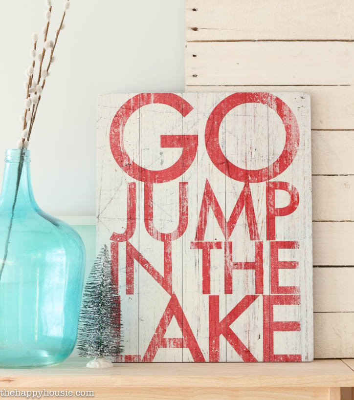 A close up of the go jump in the lake sign.