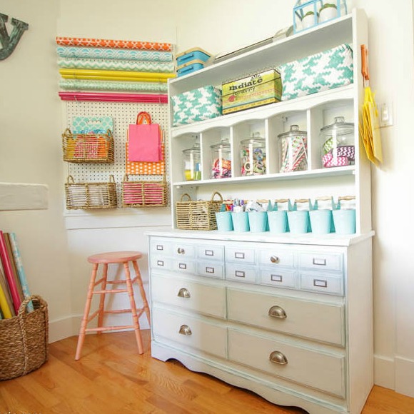 craft room storage using an old dresser and pegboard wall storage