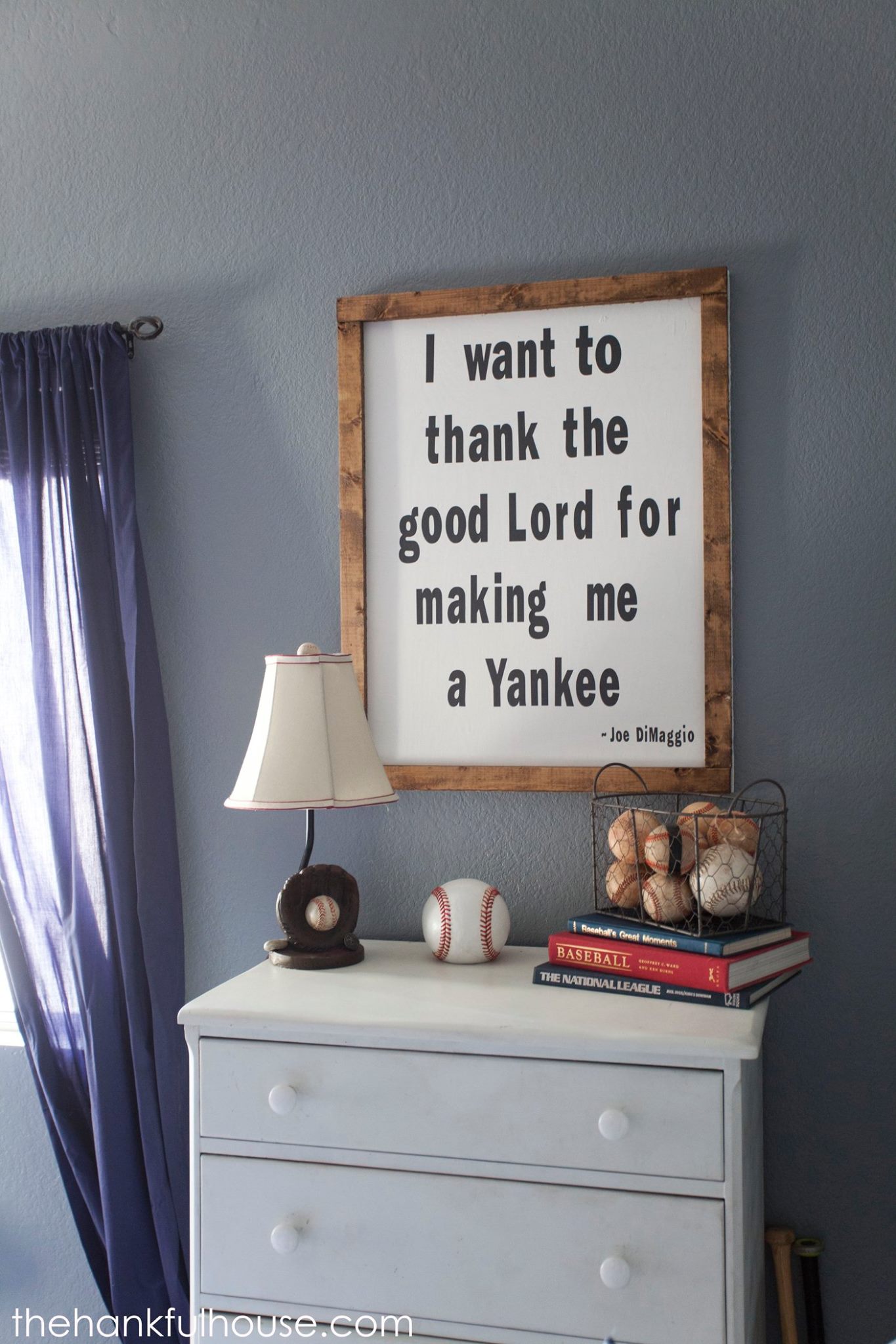 I want to thank the good lord for making me a yankee graphic in a wood frame in a bedroom.