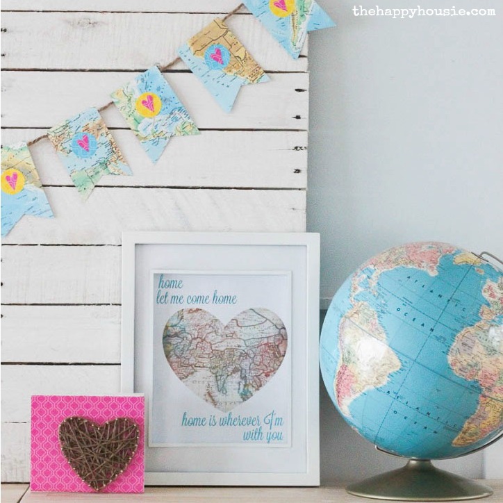 A globe and the printables on the table.