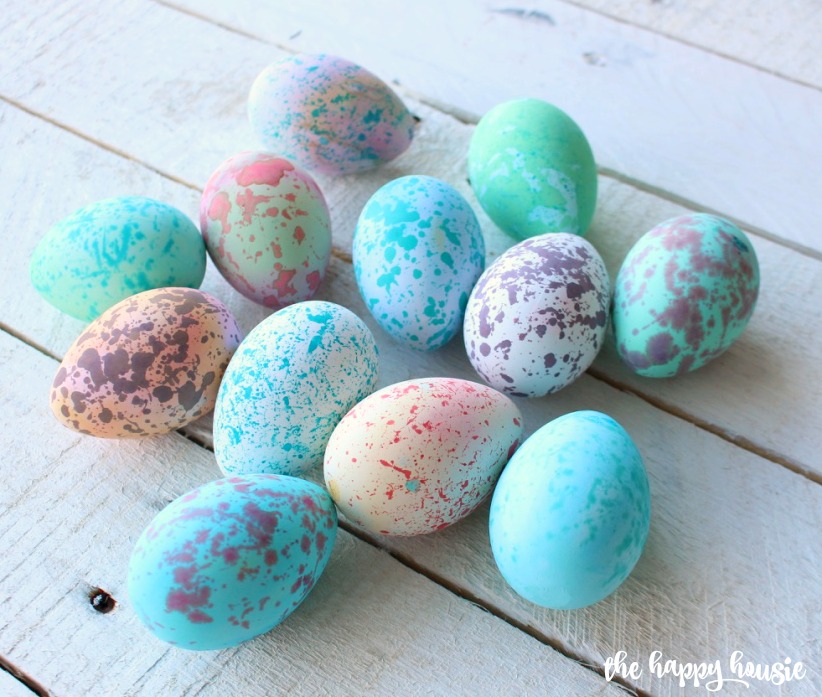 The speckled eggs on the table.