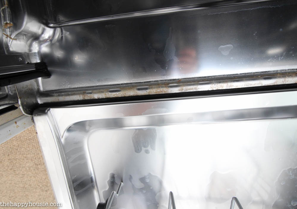 Showing the guck inside the dishwasher.