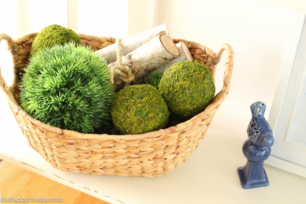 Moss balls in a basket.