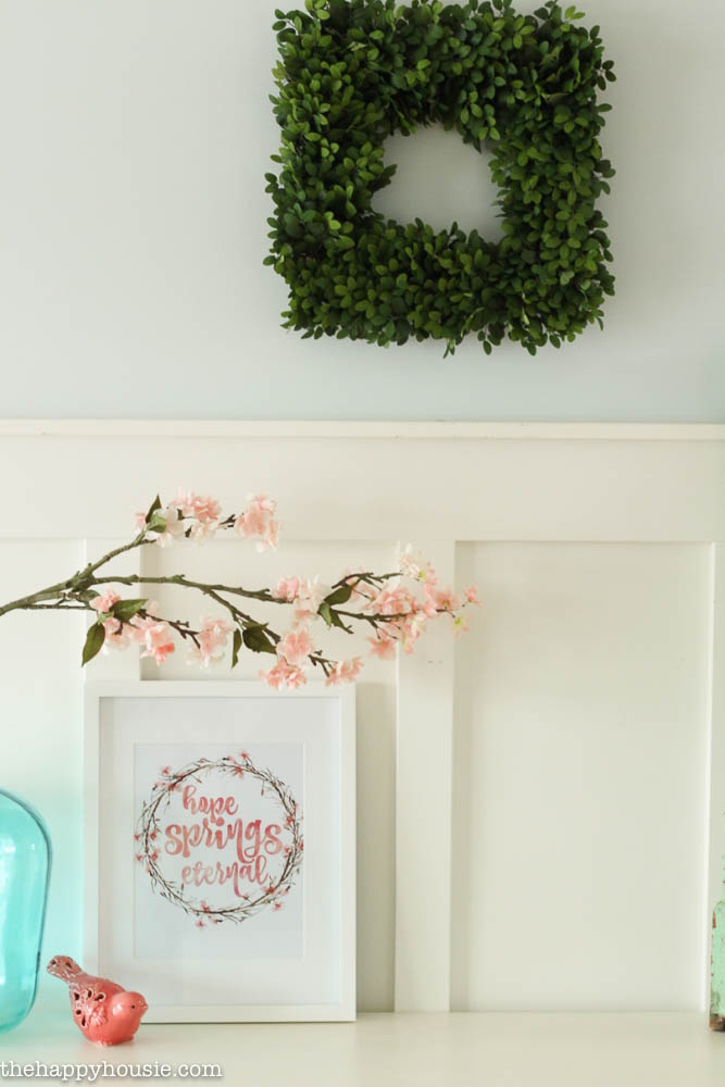 A boxwood wreath is above the printable.