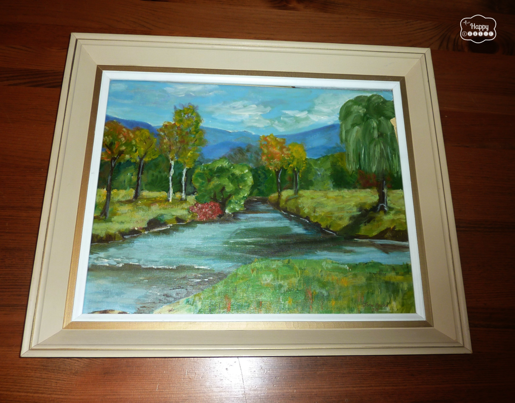 One of the framed oil paintings lying on the floor.