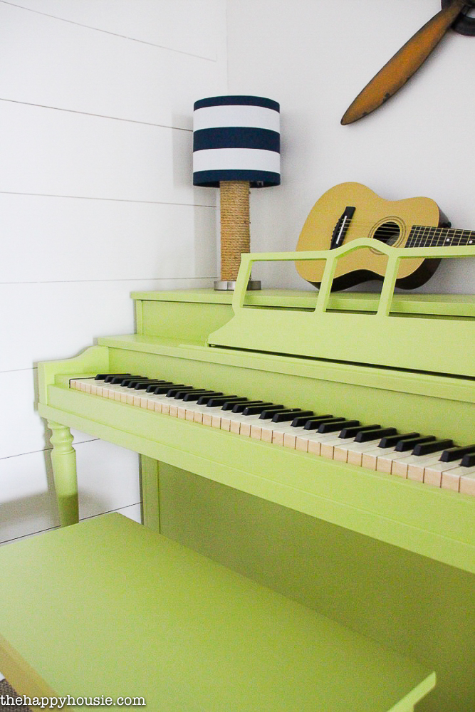 Give an old dated and damaged piano a fresh and fun look with a pop of colour.