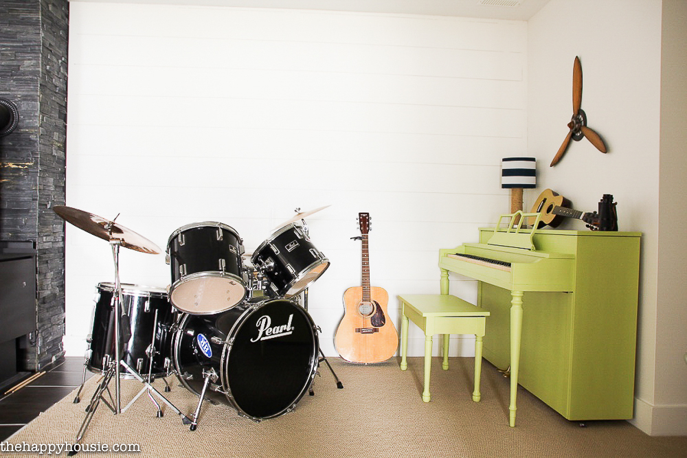 All the musical instruments in the room.