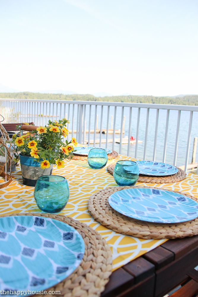 Blue plates on the outdoor dining setting overlooking the lake.