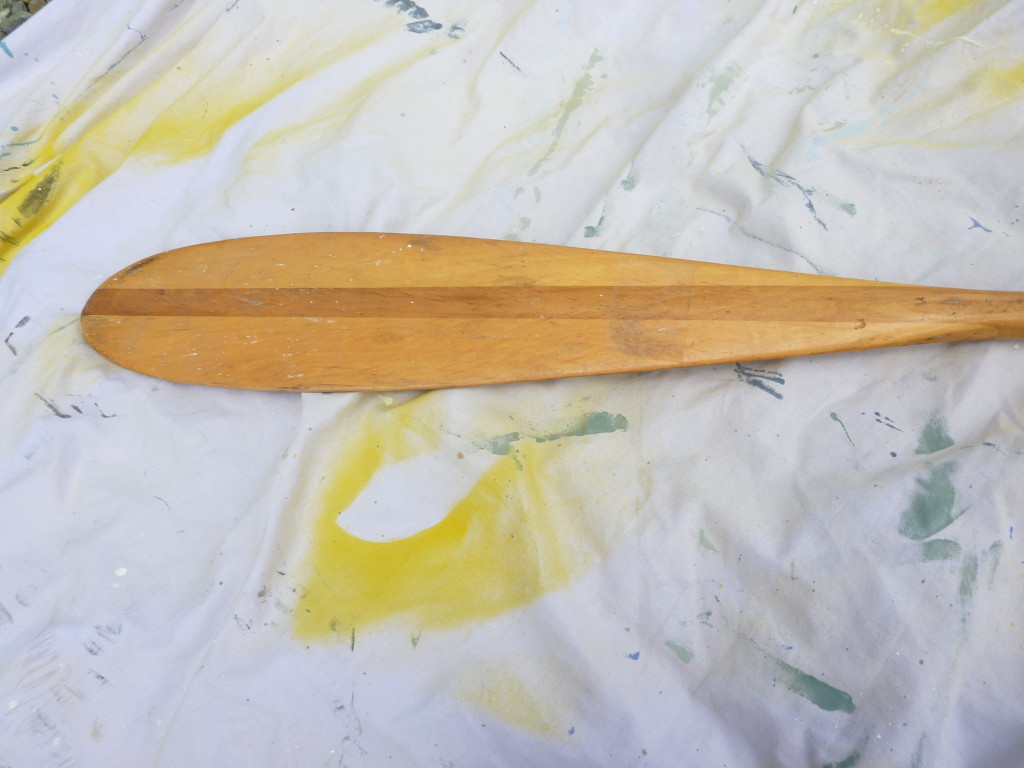 Arrow deck oar before in its natural wood state.