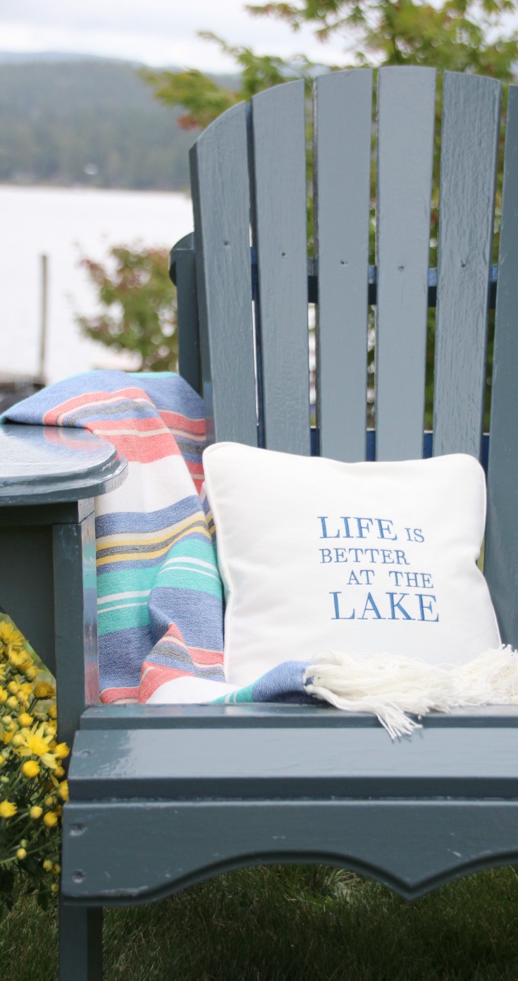 Life is better at the lake pillow on an outdoor chair.