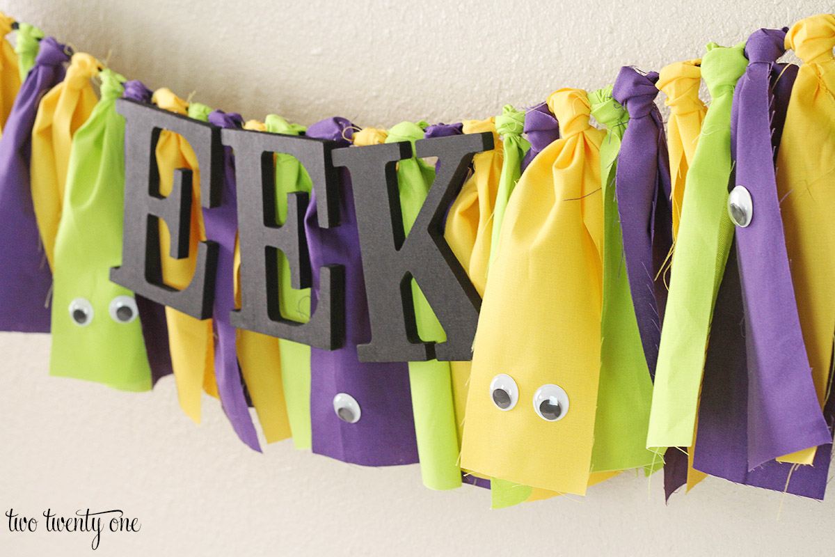 A Halloween banner in yellow and purple.
