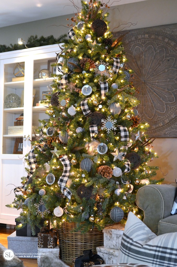 Checkered plaid on the tree in the living room.