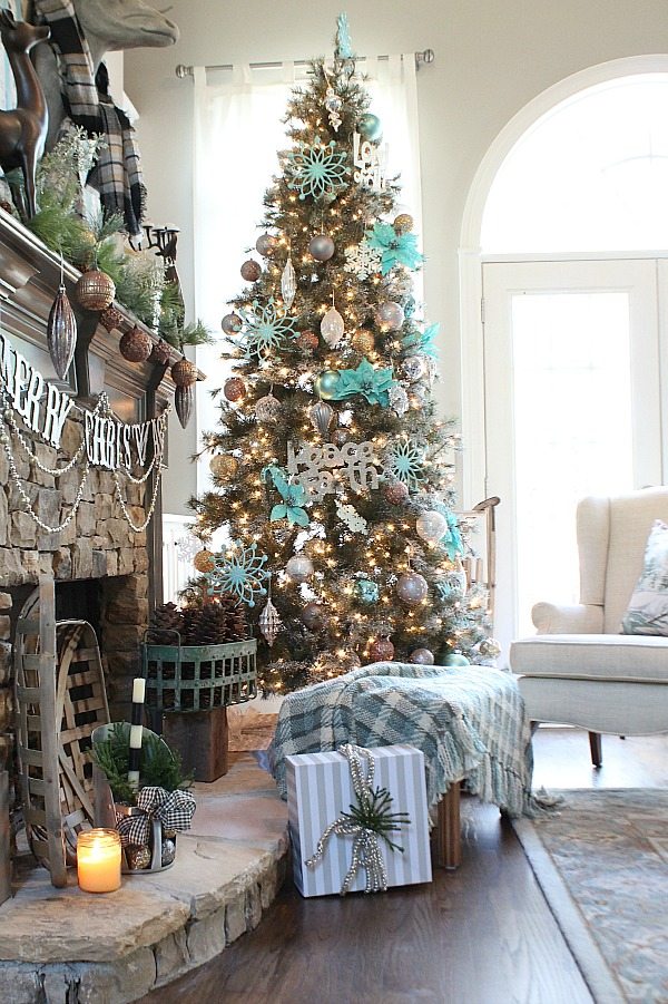The Christmas tree decorated with pops of aqua blue.