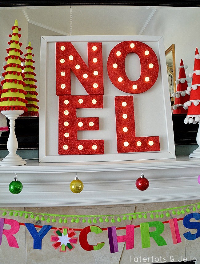 NOEL sign in red and lighted up on the mantel.