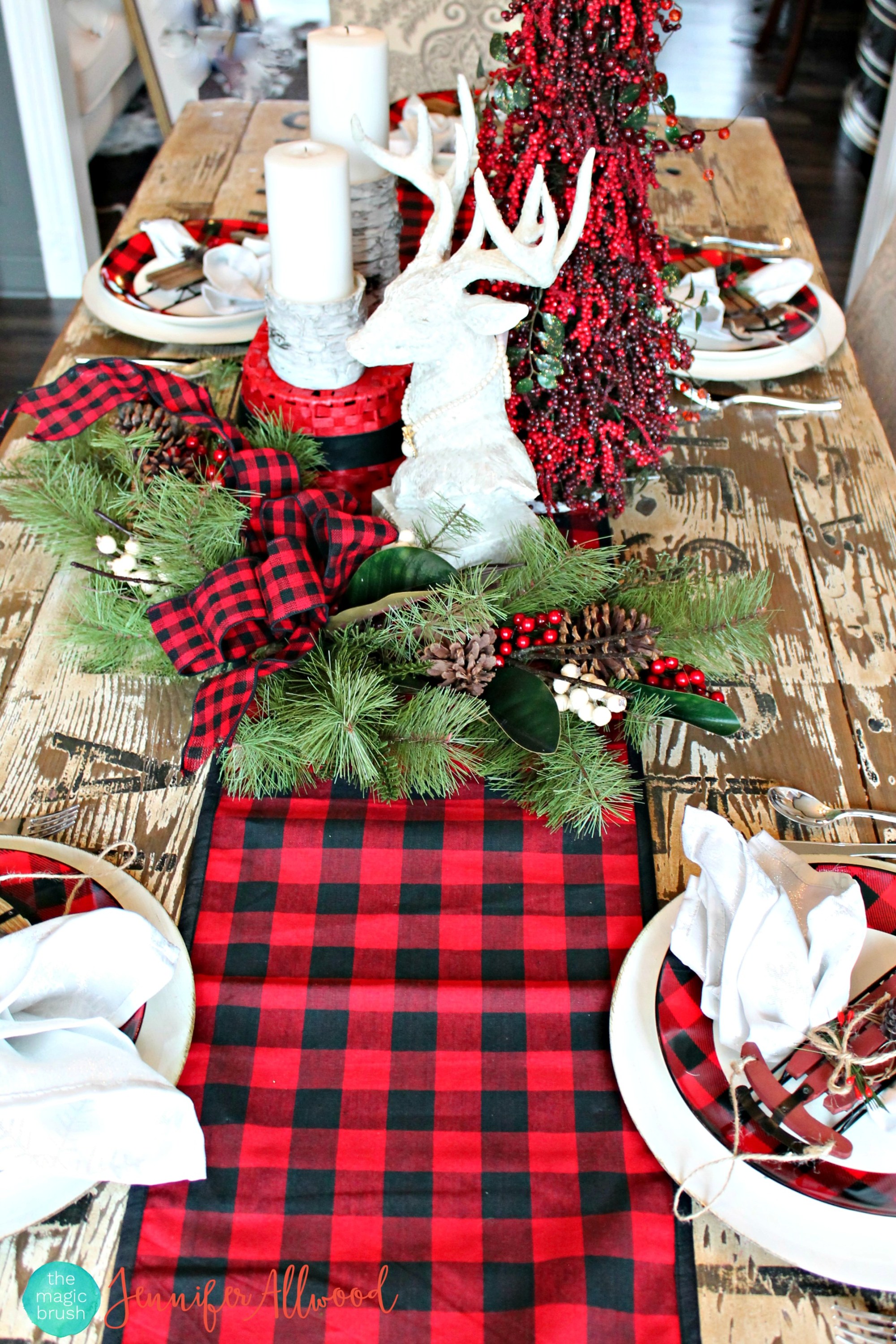 Antlers and a buffalo checked runner on the table.