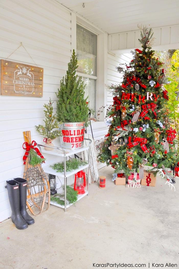 A large tree on the porch with pops of red plaid on it.