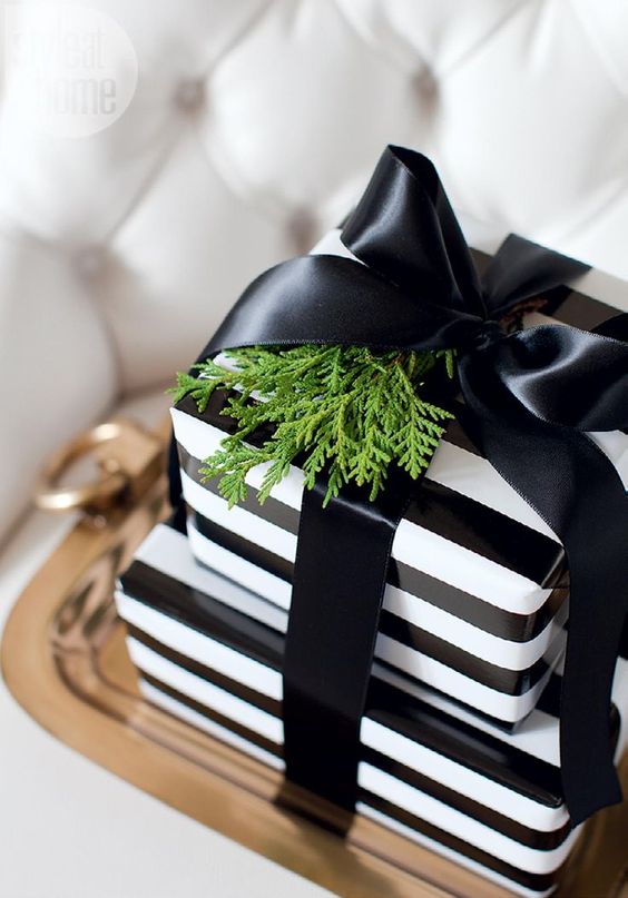 Satin black ribbon adorns this Christmas present