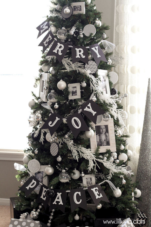 A Christmas tree with Joy and Peace banner on it.