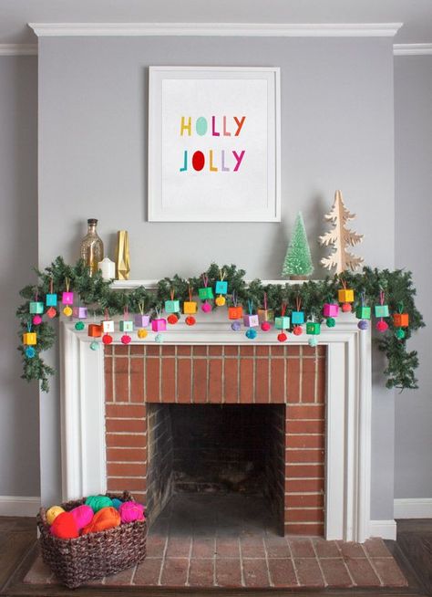 A holly jolly picture above the fireplace mantel.