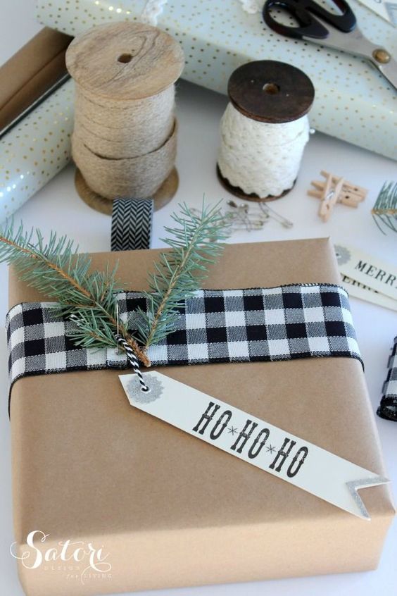 A buffalo checked ribbon adorns a wrapped present.
