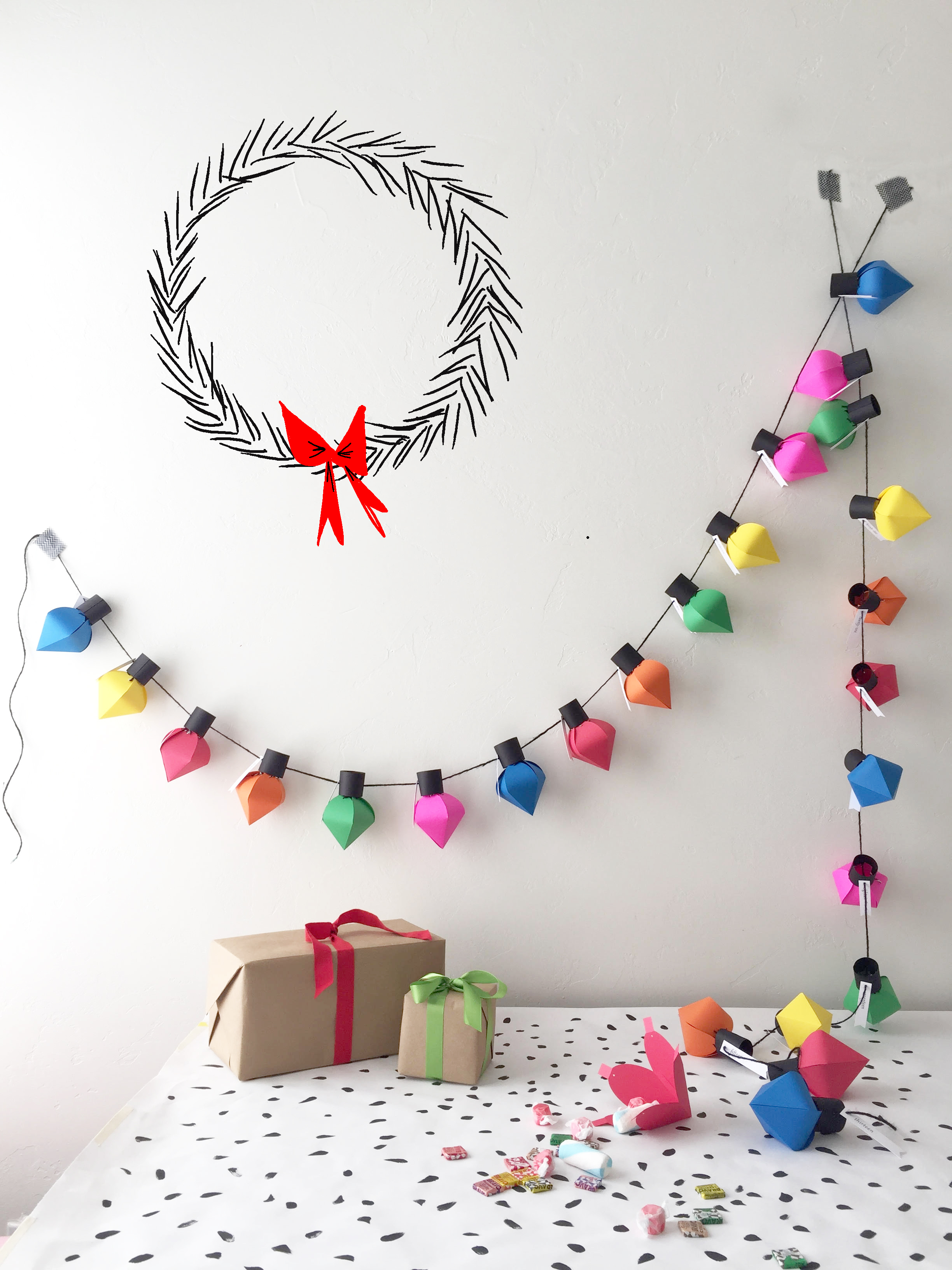 Advent wreath style with colourful paper light banner.