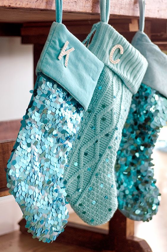 Sparkly Christmas stockings hanging up.